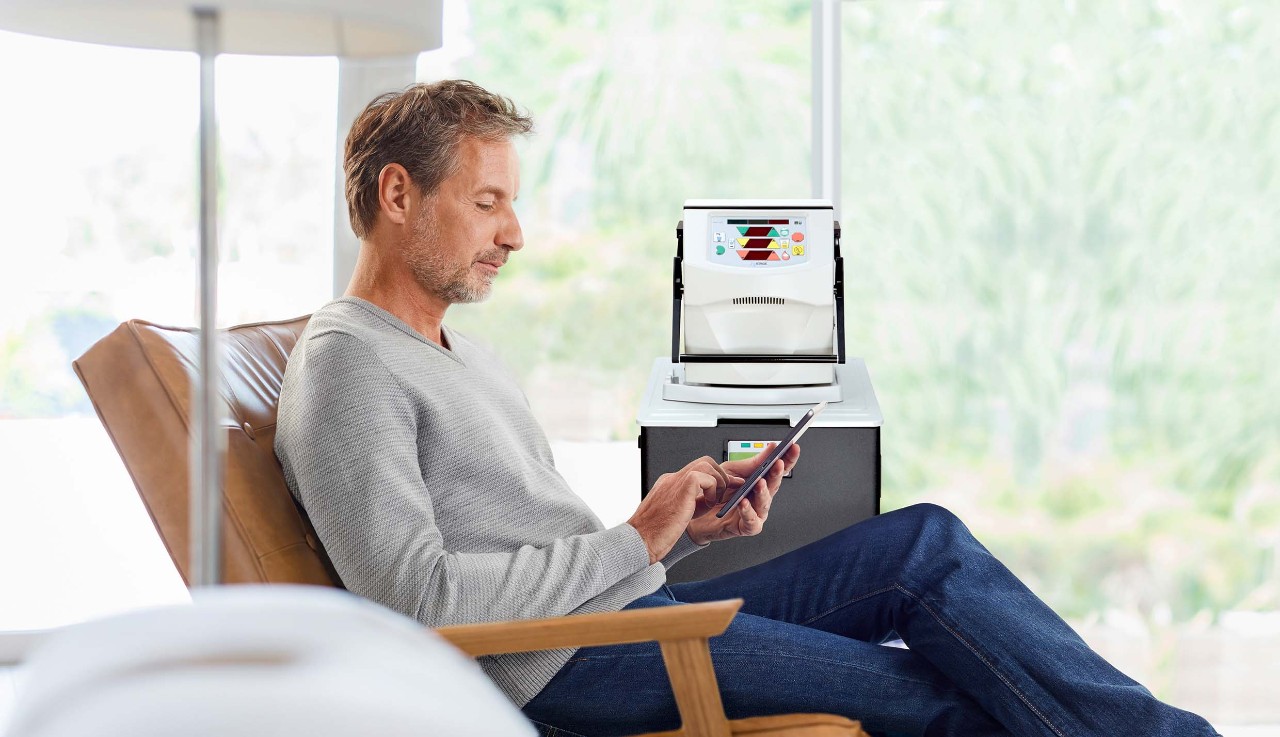 Caucasian man reading magazine in armchair