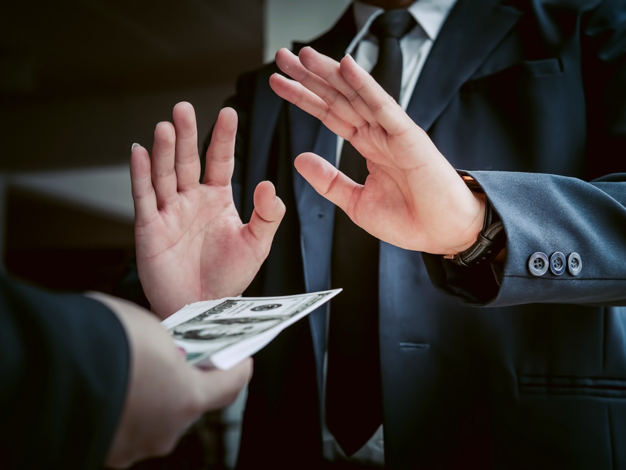 Business man refusing money to take the bribe the concept of corruption and anti bribery